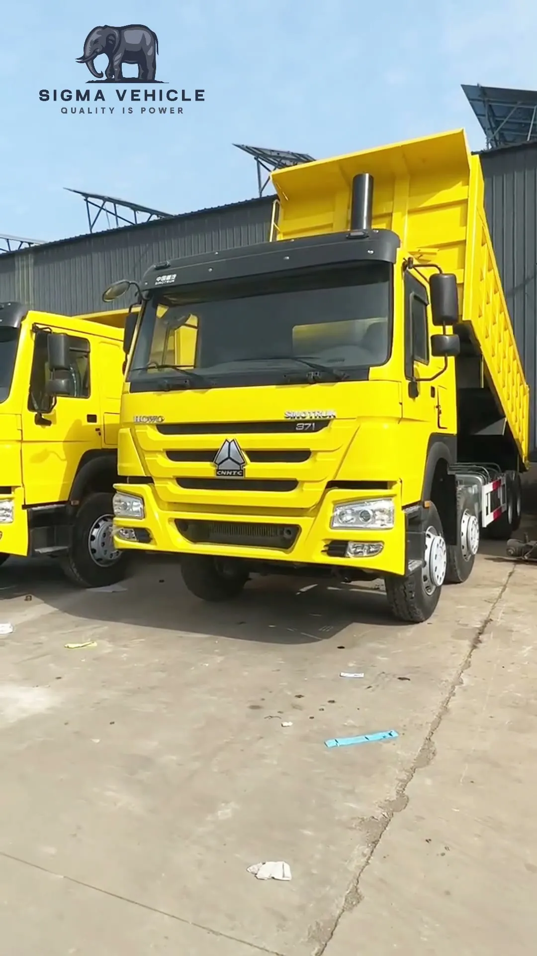 Two yellow HOWO 8x4 dump trucks prepared for export